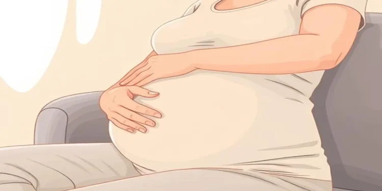 Tingling Hands in Early Pregnancy: Causes, Symptoms, and How to Find Relief 1 Pregnant woman experiencing tingling hands, massaging her wrist for relief from pregnancy-related discomfort